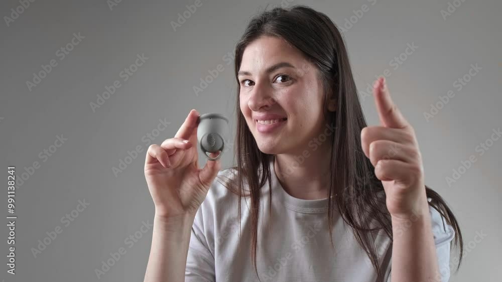 Woman holds a tampon and menstrual cup, highlighting psychological health and products supporting emotional well-being during menstruation. Woman holds a tampon and menstrual cup, highlighting psychological health and products supporting emotional well-being during menstruation.