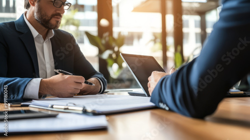 A business leader negotiating salary terms with an employee in a professional setting