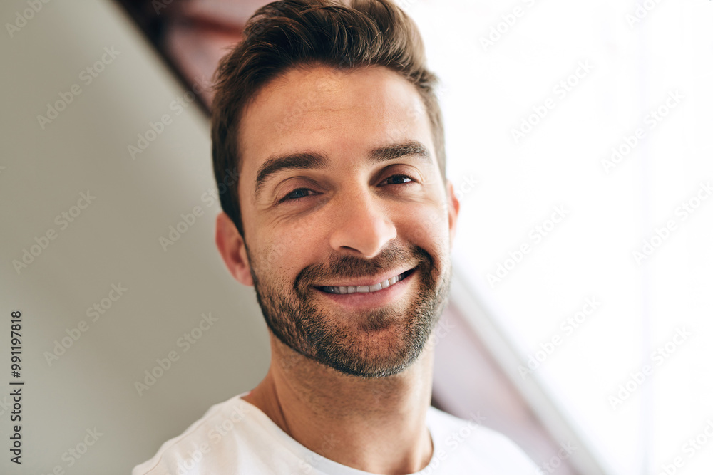 Portrait, morning and happy man in hotel to relax with leisure and healthy energy in home or apartment. Confidence, face and male person with smile in house bedroom to wakeup, rest or break in Spain Portrait, morning and happy man in hotel to relax with leisure and healthy energy in home or apartment. Confidence, face and male person with smile in house bedroom to wakeup, rest or break in Spain