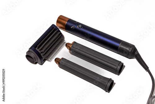 Professional hair styler, including a brush and hair dryer for drying hair, smoothing, and creating curls and waves - isolated on a white background.