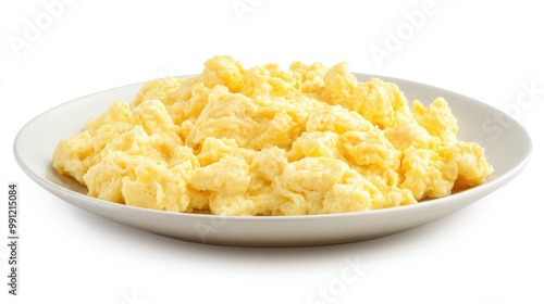 A plate of fluffy scrambled eggs, golden and soft, isolated on a clean white background, emphasizing the simplicity of a classic breakfast dish.