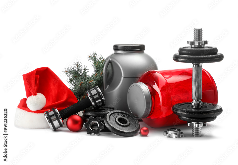 Dumbbells, containers with supplement and Christmas decor isolated on white Dumbbells, containers with supplement and Christmas decor isolated on white