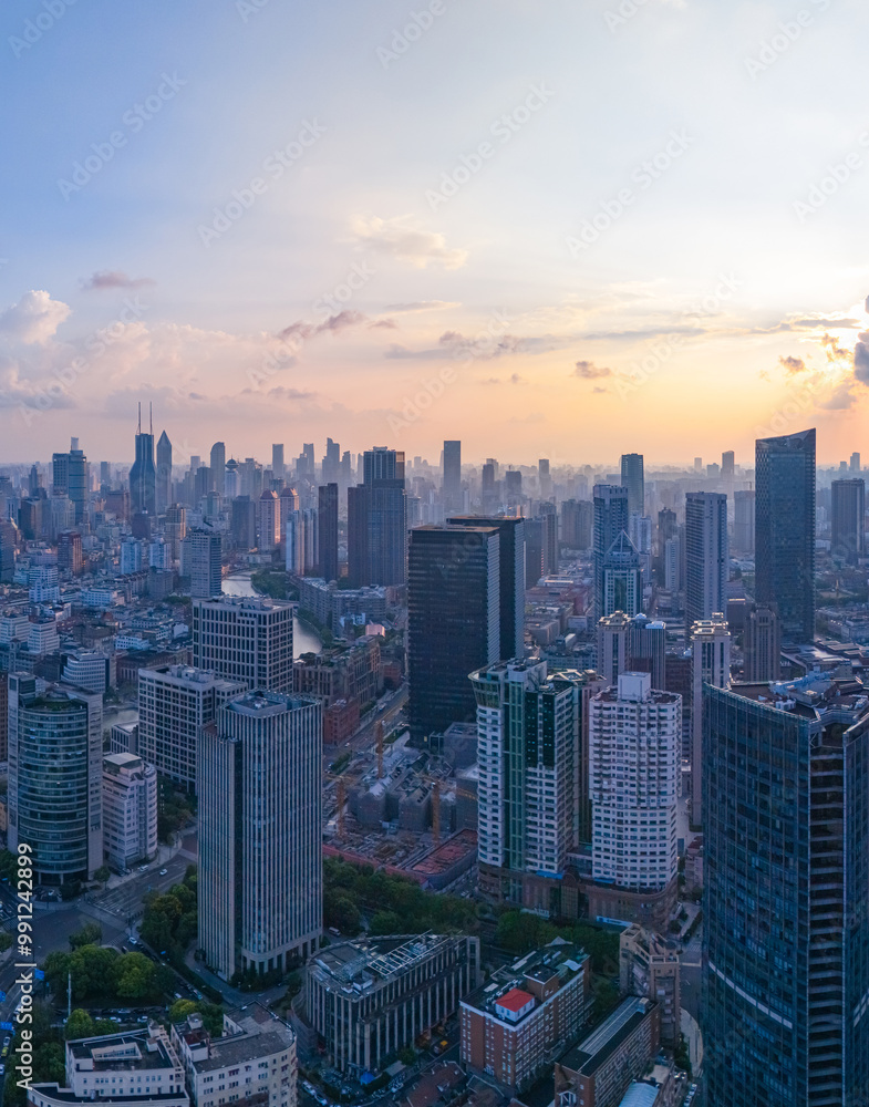 Obraz premium Aerial view of Shanghai Downtown skyline, highway roads or street . Financial district and high-rise buildings at sunset