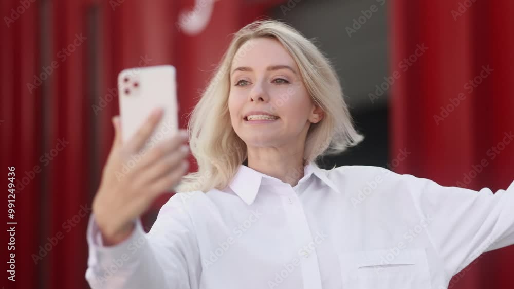 Irritated arguing young woman yelling at mobile phone by video call conference at city centre Angry nervous female talk on smartphone expressing negative emotion outdoors Irritated arguing young woman yelling at mobile phone by video call conference at city centre Angry nervous female talk on smartphone expressing negative emotion outdoors