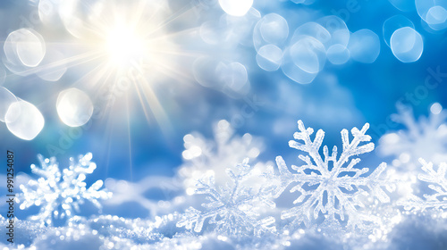 Minimalistic Christmas background with a gradient of icy blues and white snowflakes