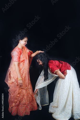 A Timeless Tradition: Mother Bestowing Blessings Upon Her Daughter in a Heartwarming Cultural Ceremony