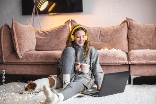 Attractive young woman with laptop at home