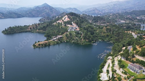 Aerial view of a serene Lake Kivu with majestic mountains behind, Kenya