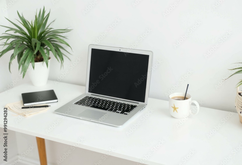 Fototapeta premium White Office Desk Displaying a Laptop and Coffee Cup