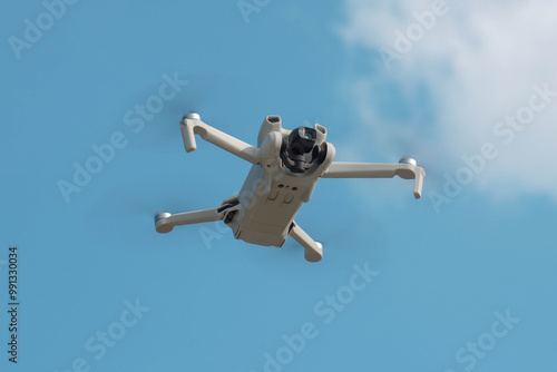 Mini Drone soaring high in the sky, capturing breathtaking aerial footage with its advanced camera. This compact drone offers incredible features like 4K60fps video recording, 11.2-inch sensor.