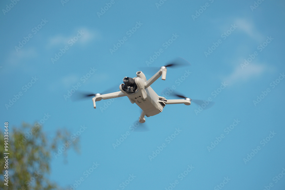 Mini Drone soaring high in the sky, capturing breathtaking aerial footage with its advanced camera. This compact drone offers incredible features like 4K60fps video recording, 11.2-inch sensor. Mini Drone soaring high in the sky, capturing breathtaking aerial footage with its advanced camera. This compact drone offers incredible features like 4K60fps video recording, 11.2-inch sensor.