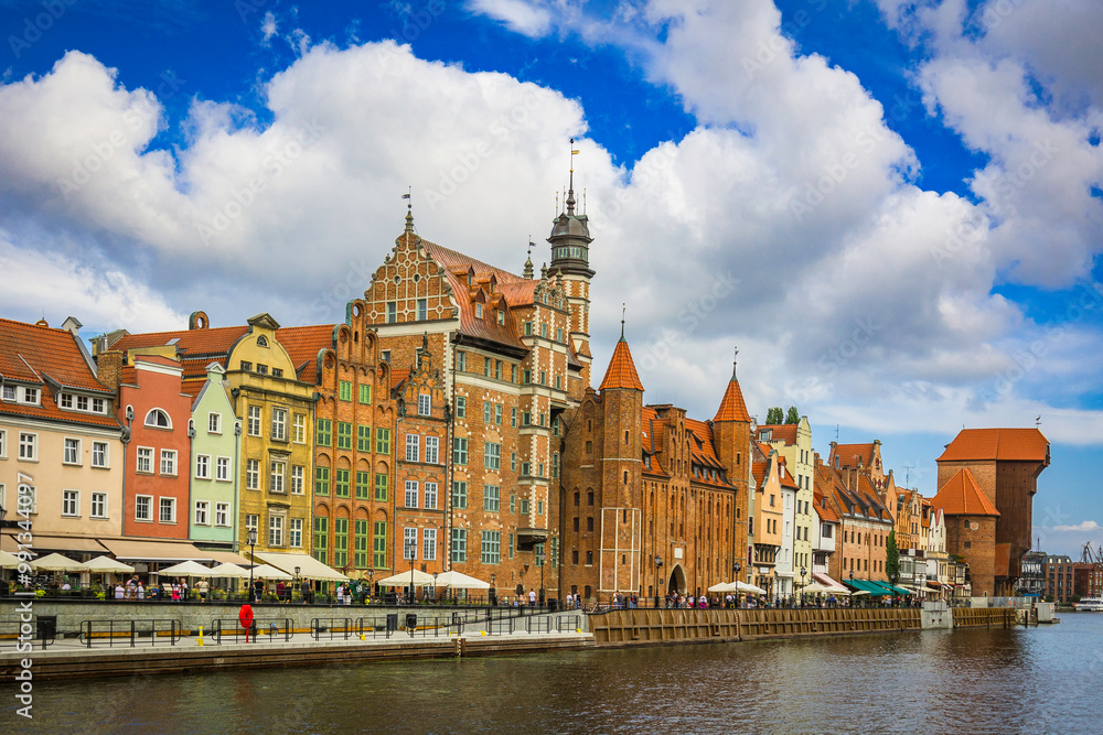 Beautiful city of Gdansk in the margins of the Motlawa river with the touristic boats and coloured buildings Beautiful city of Gdansk in the margins of the Motlawa river with the touristic boats and coloured buildings
