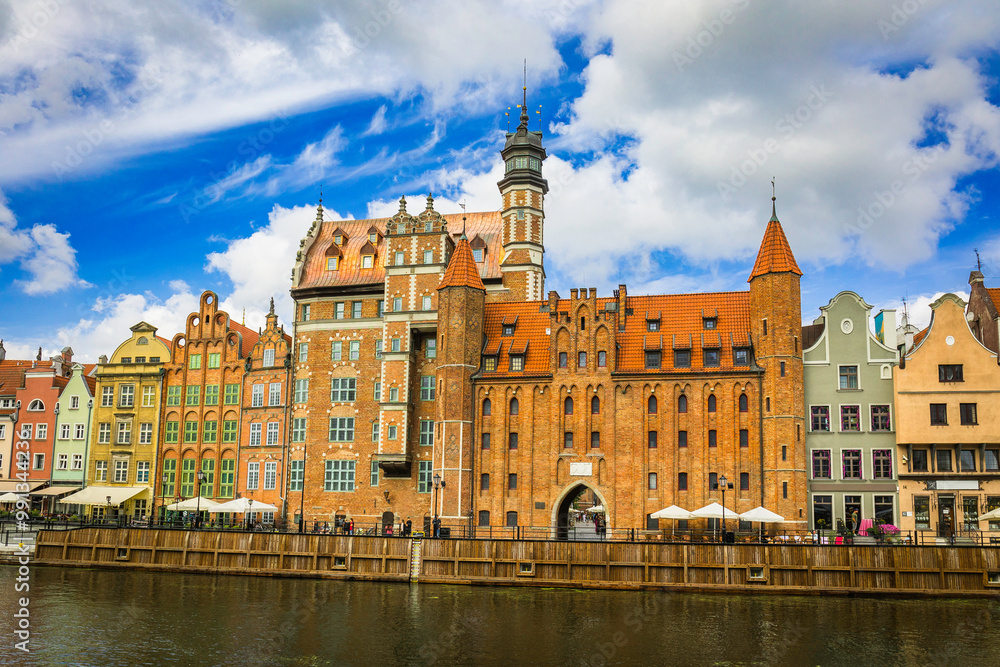 Beautiful city of Gdansk in the margins of the Motlawa river with the touristic boats and coloured buildings Beautiful city of Gdansk in the margins of the Motlawa river with the touristic boats and coloured buildings
