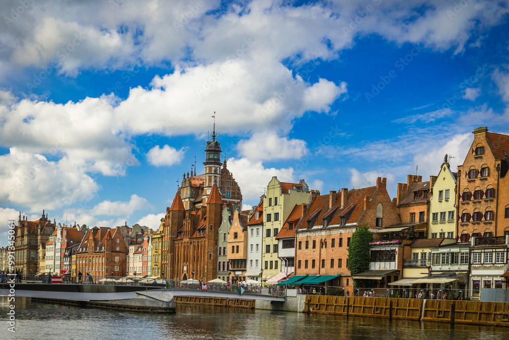 Fototapeta premium Beautiful city of Gdansk in the margins of the Motlawa river with the touristic boats and coloured buildings