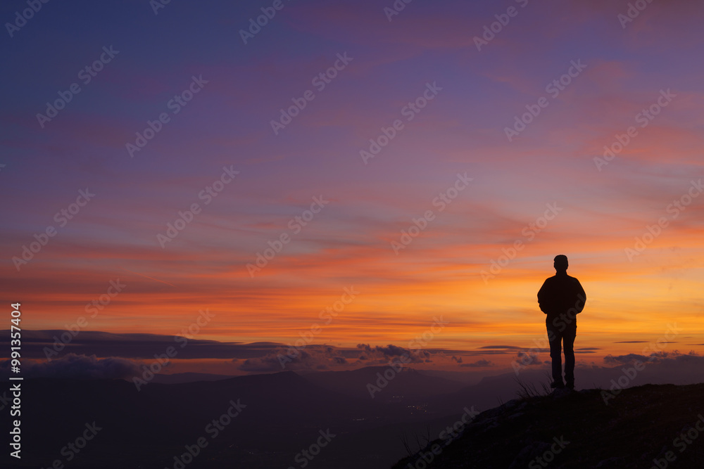 Man at sunset. Sky at sunset in San Miguel de Aralar, Navarra. Man at sunset. Sky at sunset in San Miguel de Aralar, Navarra.