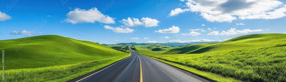 Endless highway stretching through explore green hills under blue sky Endless highway stretching through explore green hills under blue sky