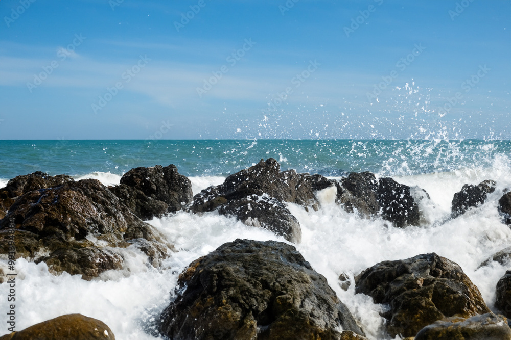 Rocks and waves in the sea with a foam. Beach ocean coast concept. Rocks and waves in the sea in nature with foaming water. Rocks and foaming water in nature lifestyle. Rocks and waves in the sea with a foam. Beach ocean coast concept. Rocks and waves in the sea in nature with foaming water. Rocks and foaming water in nature lifestyle.