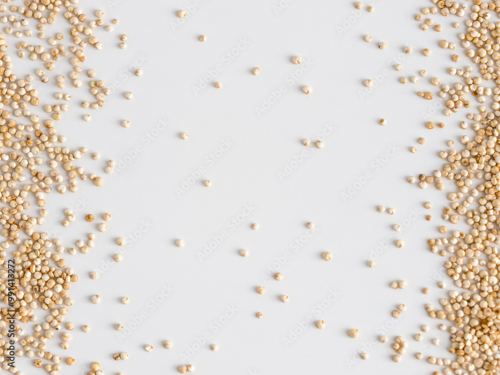Grain of real quinoa isolated on white background. Uncooked raw quinoa as background. Healthy vegan food concept and pattern. Copy space. Top view or flat lay. Grain of real quinoa isolated on white background. Uncooked raw quinoa as background. Healthy vegan food concept and pattern. Copy space. Top view or flat lay.
