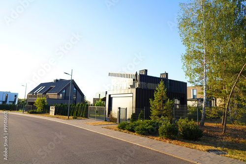 Wallpaper Mural Modern luxury Villa. Street Road in Contemporary Residence with Barnhouse. Modern Barn house. Barn home with lawn, shrubs, green courtyard in sustainable enviroment. Family House in Gated Community. Torontodigital.ca