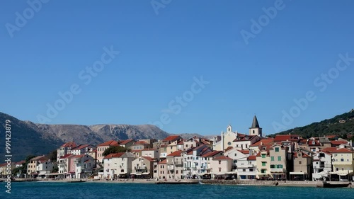 Wallpaper Mural Static Shot of Baška Town on Krk Island, Croatia – Waves Hitting Seaside Promenade with People Walking Torontodigital.ca