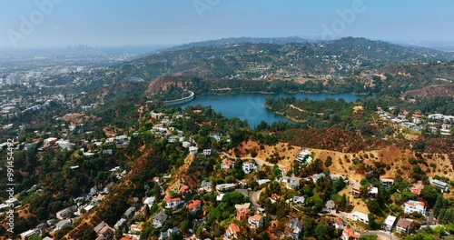 Hollywood Reservoir in the Hollywood Hills in the Santa Monica Mountains, Los Angeles, California, USA. Beautiful residential area on the hills on sunny day. Top view.