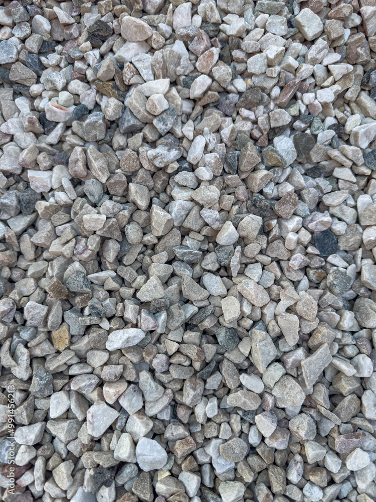 Background of natural gray small pebbles or stone in a garden paths and flower beds. Background of natural gray small pebbles or stone in a garden paths and flower beds.
