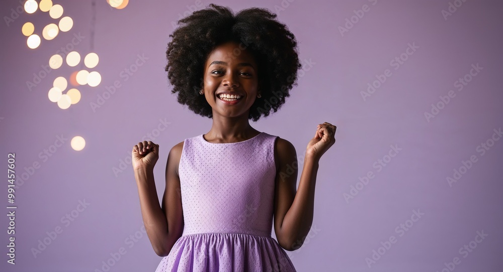 Young Black girl in a stylish dress posing joyfully against a light lavender background Young Black girl in a stylish dress posing joyfully against a light lavender background