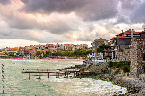 sozopol, bulgaria - 05 sep 2019: embankment of the ancient resort town by the sea at sunset. cloudy sky photo