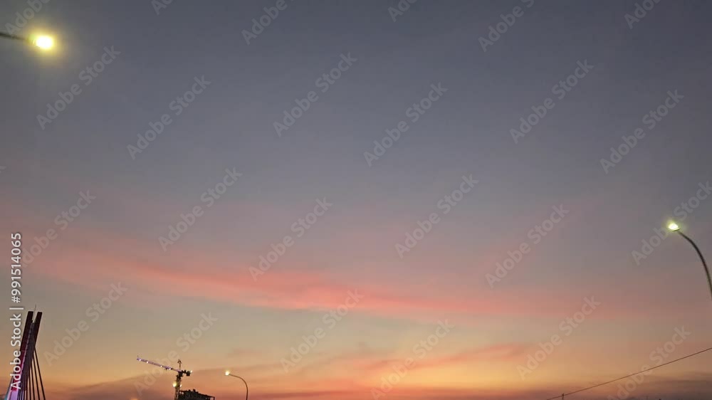 Slow motion video of the orange evening sky in the city Slow motion video of the orange evening sky in the city