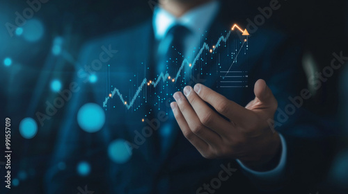 Businessman holding virtual graph with rising trend, concept of growth and success