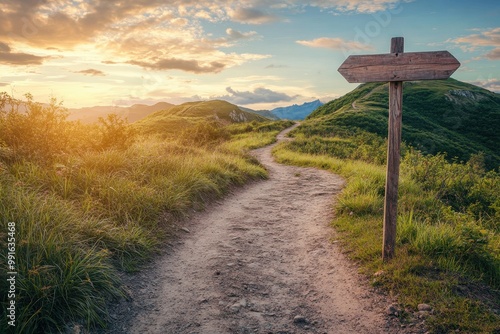 Scenic Dirt Path with Wooden Signpost at Sunset photo