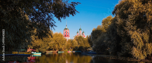 The Golden Ring of Russia, the city of Pereslavl-Zalessky. The Church of the Forty Martyrs of Sebaste is reflected at dawn in Pleshcheyev Lake. photo