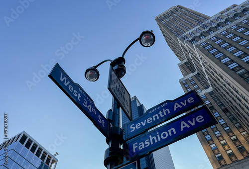 West 34th Street and Seventh Avenue, also called as Fashion Avenue crossroads street sign in New York City