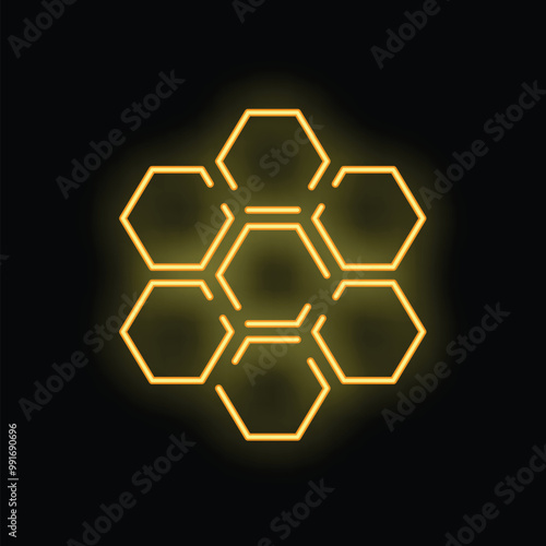 Yellow neon sign in the shape of a honeycomb glowing on a black background