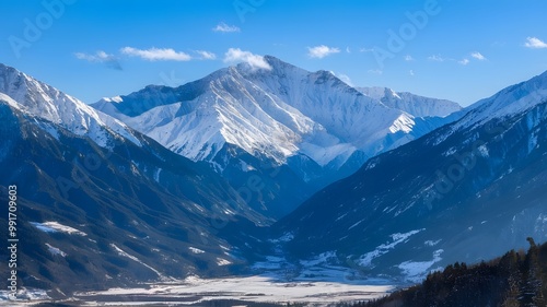 Majestic Snow-Capped Mountains Under Bright Blue Winter Sky with Snowy Valley