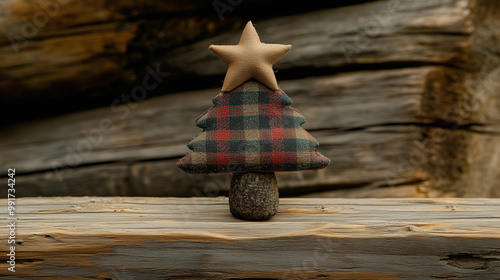 Festive Fabric Christmas Tree Decoration With a Star Atop Set Against a Rustic Wooden Background photo