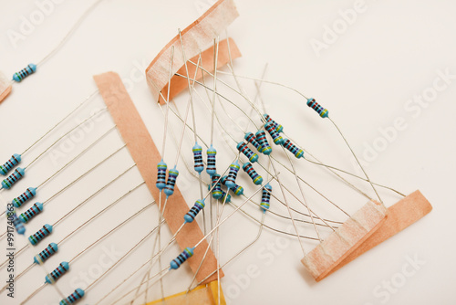 Foto Electronic components. Film resistors on a white background.