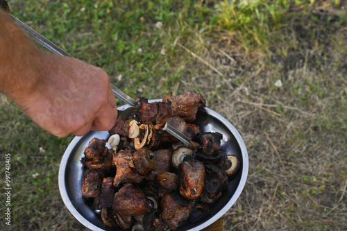 the finished kebab is removed from the skewer photo