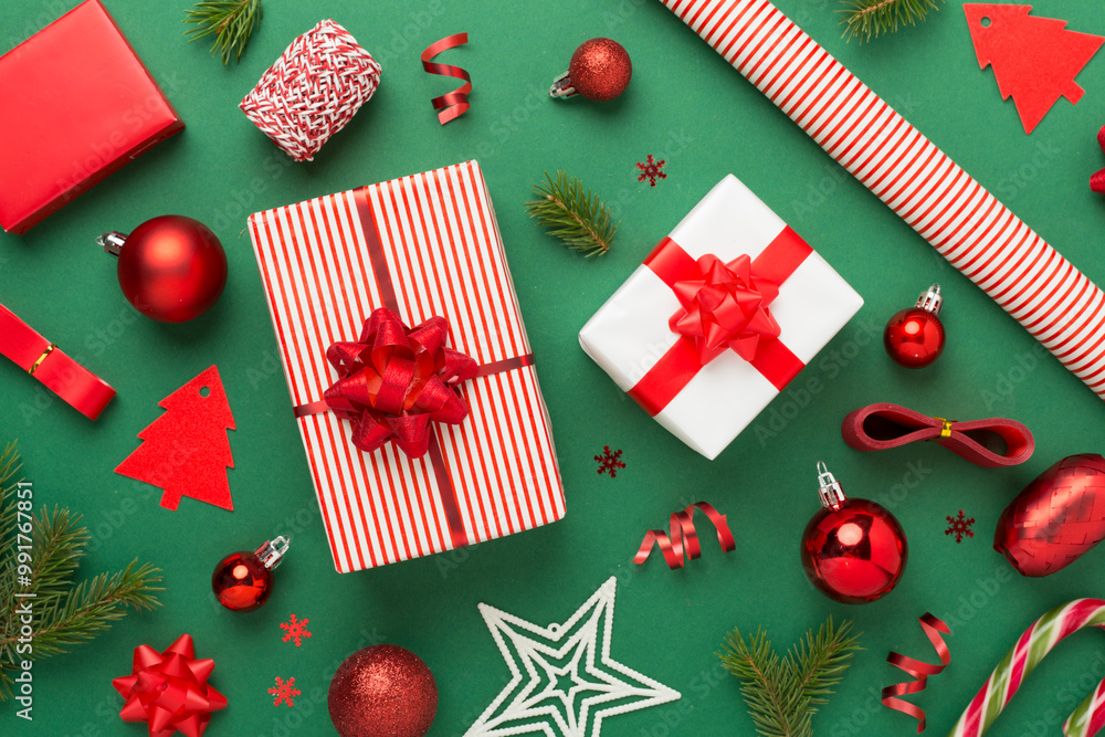 Handmade wrapped christmas gift boxes with stuff on color background, top view Handmade wrapped christmas gift boxes with stuff on color background, top view