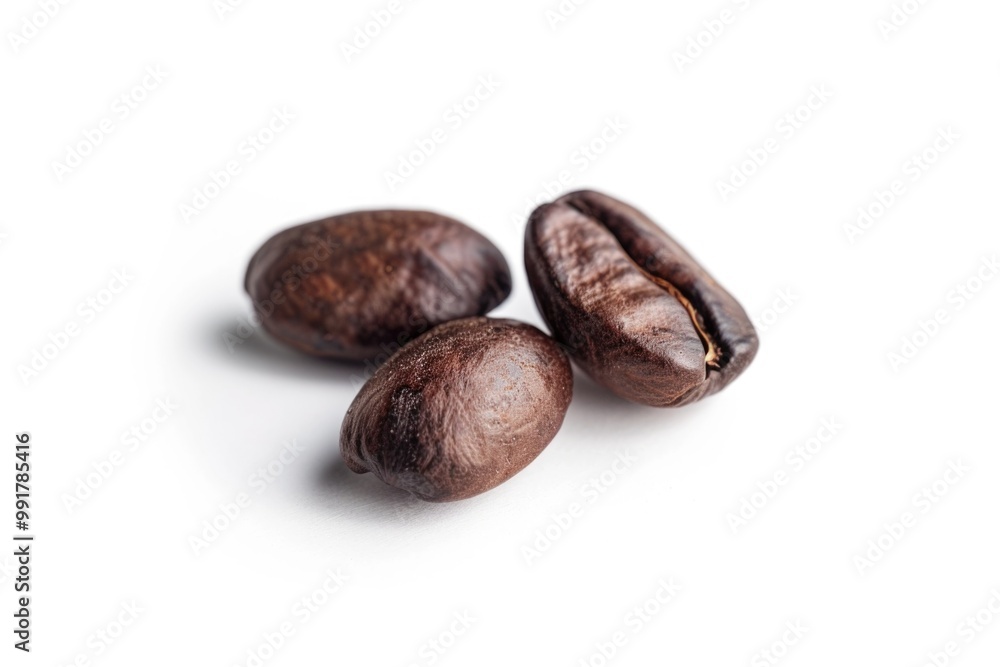 A group of coffee beans arranged on a clean white surface A group of coffee beans arranged on a clean white surface