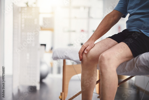 Knee pain, injury and old man in rehabilitation center for holistic healing, chiropractor and physiotherapy. Healthcare, muscle tension and accident with senior patient in physical therapy clinic