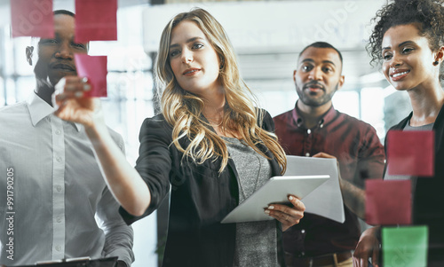 Sticky notes, glass and woman with tablet, office and collaboration of people or stock market. Brainstorming, financial advisor and discussion of group, reading or planning for investment opportunity photo