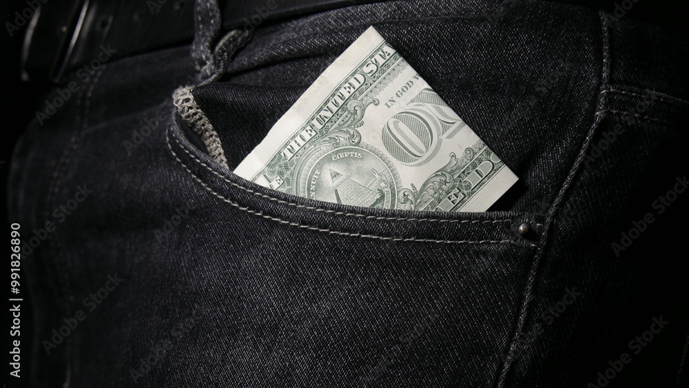 One dollar is sticking out of pocket One dollar is sticking out of pocket