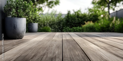 image depicts a close-up of a wooden terrace or deck, focusing on the grain and texture of the wood planks