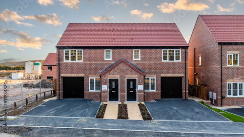 A row of new build homes with sold sign