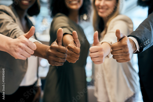 Business people, hands and team with thumbs up for good job, winning or success together at office. Closeup, group or employees with like emoji, yes sign or OK for well done, vote or positive review photo