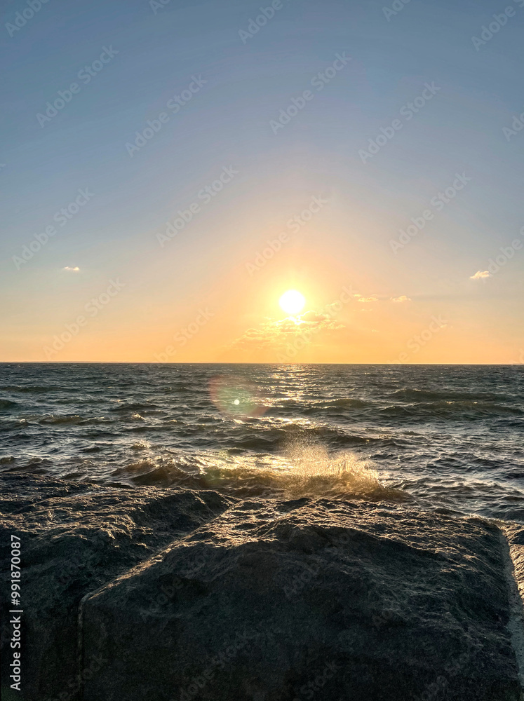 Scenic view of ocean against setting sun Scenic view of ocean against setting sun