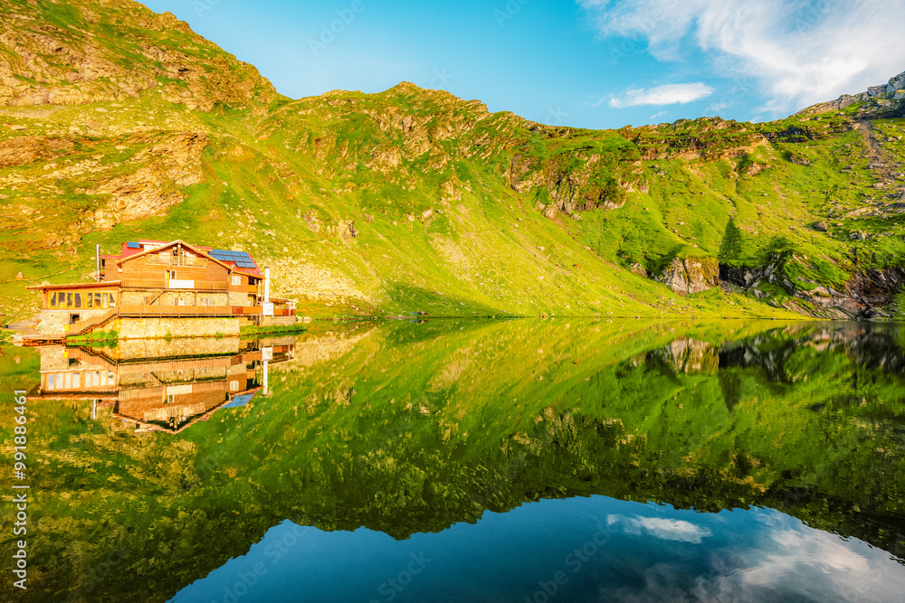 Naklejka premium Fagaras mountains with Balea lake on Transfagarasan serpentine road in Sibiu County, Romania.