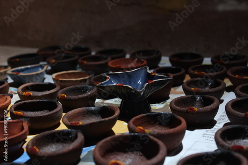 Artistic homemade clay oil lamps or karthikai deepam are ready for diwali and karthikai festivals