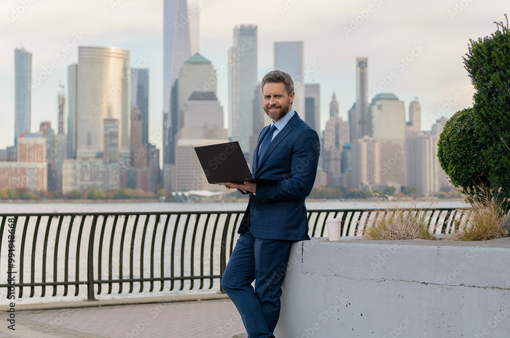 Business man working online. Successful businessman freelancing online. Business success. Businessman working on laptop outdoor. Business man typing on laptop in New York. Sustain growth Business man working online. Successful businessman freelancing online. Business success. Businessman working on laptop outdoor. Business man typing on laptop in New York. Sustain growth